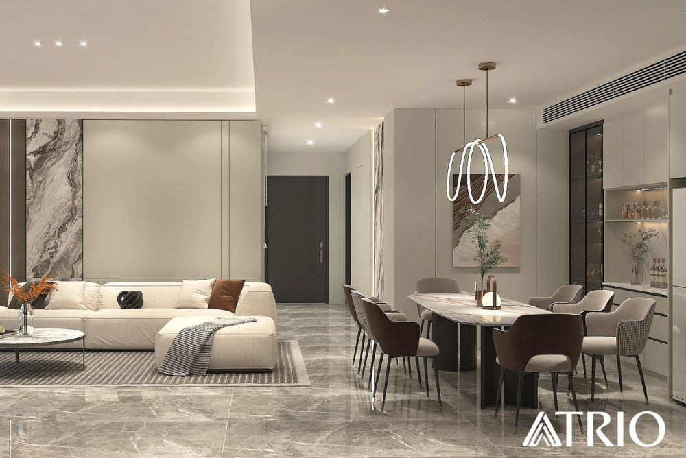 A Trio Design living and dining area with marble accents and ceiling grilles