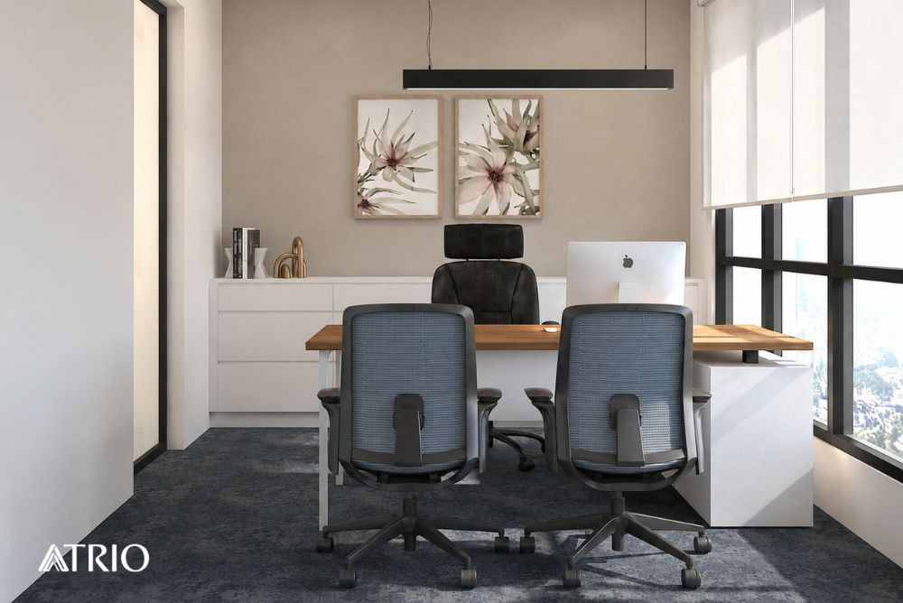 A Trio Design meeting area with blue chairs, timber desk and daylight