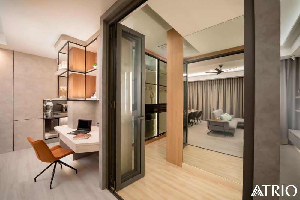 Glass folding door links the bedroom and living area in a hotel-style Petaling Jaya condo