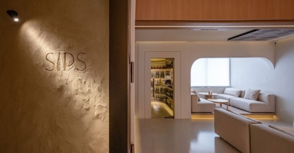 Sips entrance with curved openings, textured walls and lounge seating